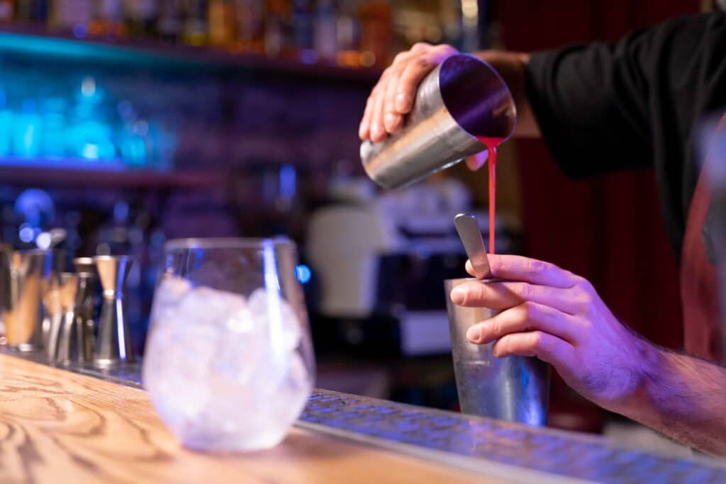 bartender mixing alcohol