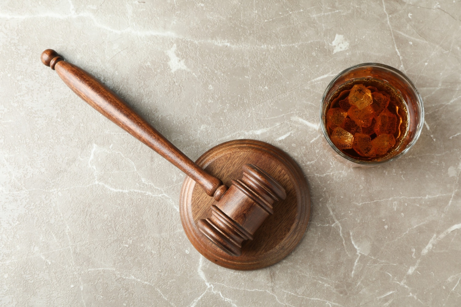 gavel and hard liquor glass
