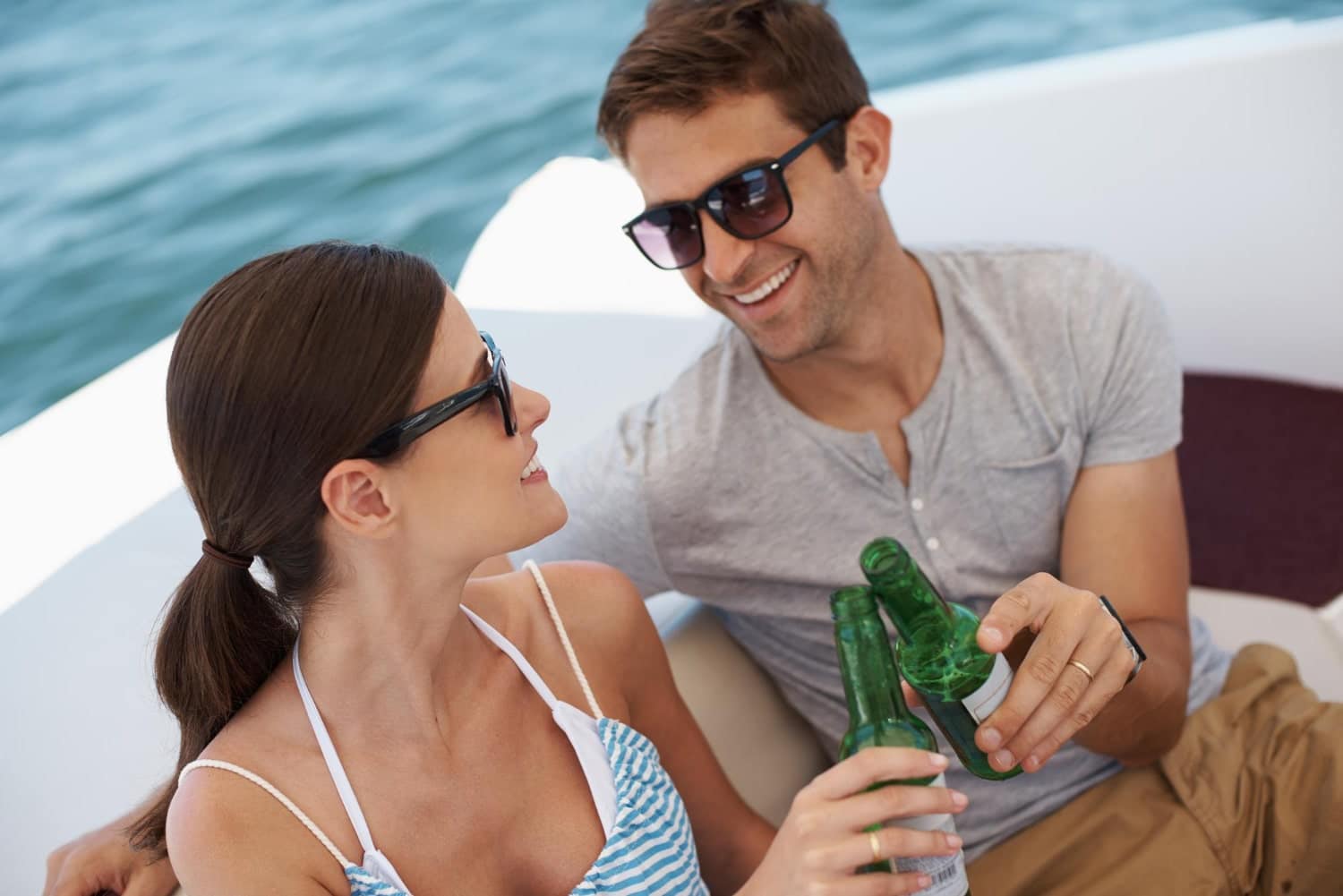 a couple drinking on a boat