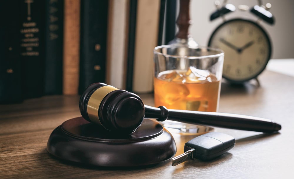 judge's gavel and alcohol glass