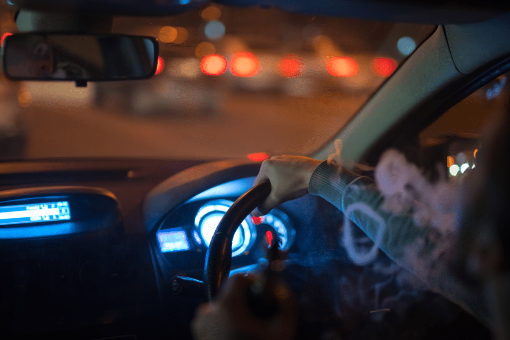 A man using cannabis in the vehicle